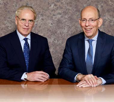 Photo of attorneys D. Carl Lustig III and Mitchell J. Sassower